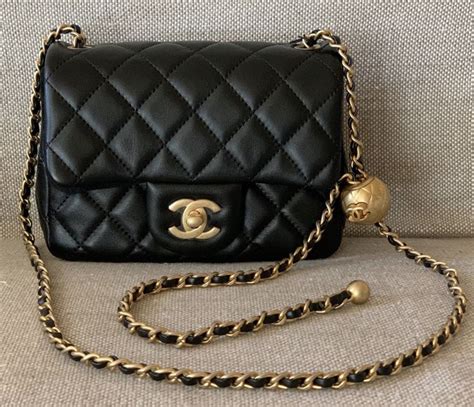 chanel bag with gold ball.